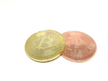 High angle view of coins on white background