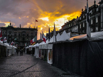 Buildings against cloudy sky at sunset