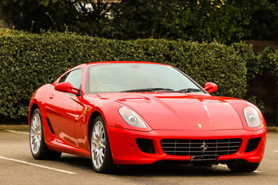 Red toy car on road