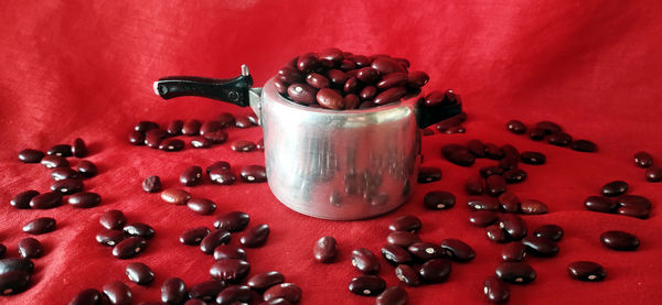 High angle view of coffee beans in glass on table