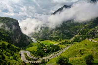 High angle view of mountain road against cloudy sky