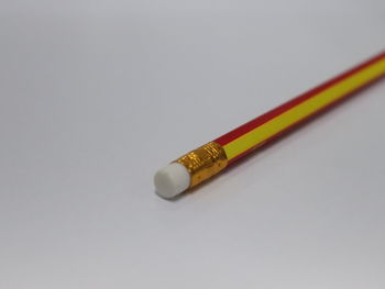 Close-up of colored pencils against white background