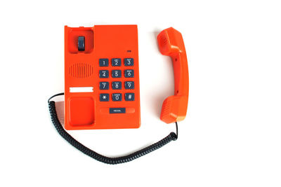 Close-up of telephone booth against white background