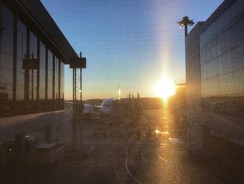 Close-up of metal structure against sky at sunset