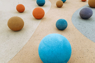 High angle view of multi colored ball on sand