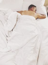 Man sleeping on bed