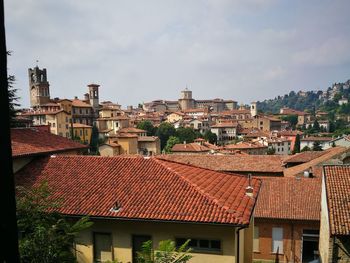 Buildings in city against sky