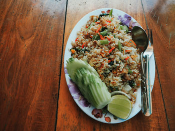 High angle view of chopped vegetables in plate on table