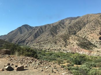 Scenic view of mountains against clear blue sky