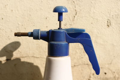 Close-up of faucet on beach