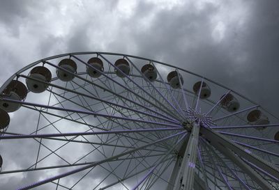 Low angle view of ferris wheel against sky