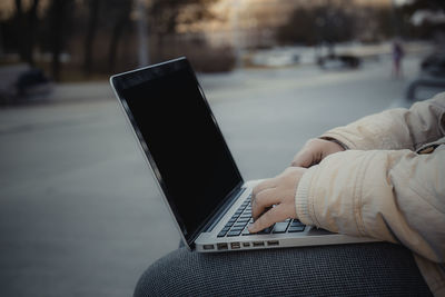 Close-up of man using mobile phone