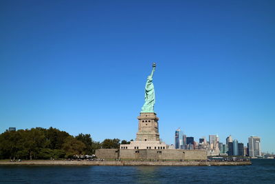 Statue of liberty against blue sky