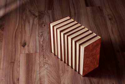 Stack of books on wooden background