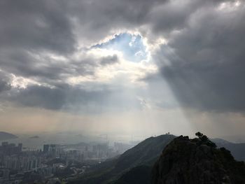 Scenic view of mountains against cloudy sky