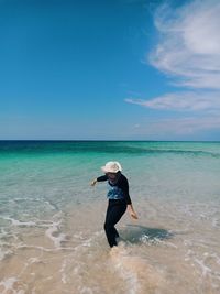 Full length of man on beach against sky