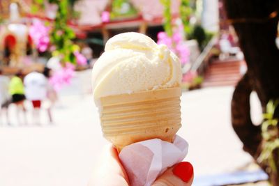 Cropped hand of woman holding ice cream cone