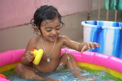 Girl playing in swimming pool