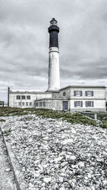 Lighthouse against sky in city