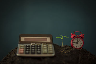 Close-up of clock on table