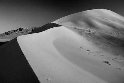 Scenic view of desert against clear sky