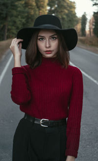 Portrait of a beautiful young woman wearing hat