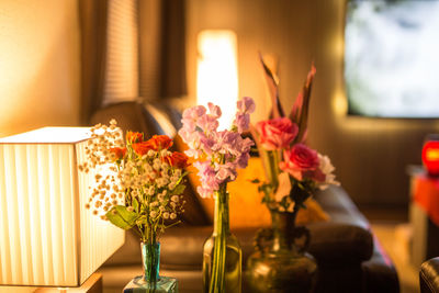 Close-up of flower vase on table at home