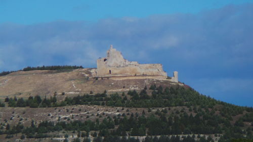 Building against cloudy sky