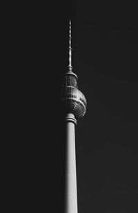 Low angle view of communications tower against sky