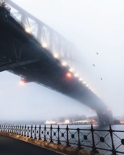 Bridge over sea against sky