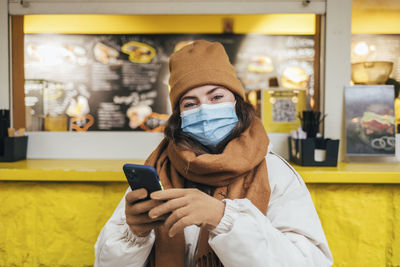 Portrait of man using mobile phone