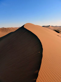 View of desert against clear sky