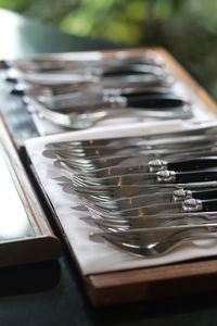 High angle view of table knife and fork arranged on table