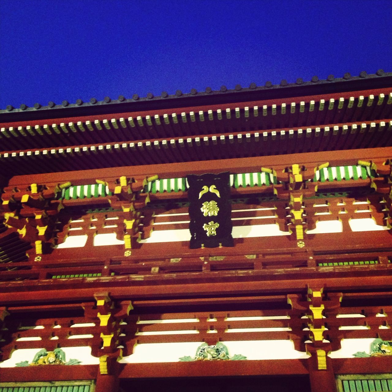 built structure, architecture, illuminated, low angle view, blue, indoors, lighting equipment, building exterior, metal, window, clear sky, no people, hanging, door, building, gate, safety, night, security