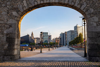 View of city buildings against clear sky