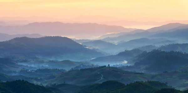 Scenic view of mountains against sky during sunset