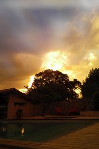 Silhouette of trees against sky at sunset