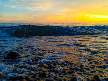 Scenic view of sea against sky during sunset