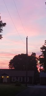 Silhouette trees against sky during sunset