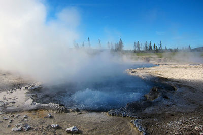 Steam emitting from hot spring at yellowstone national park