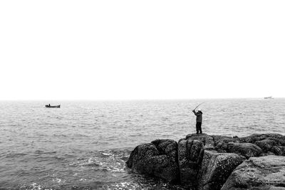 Scenic view of sea against clear sky