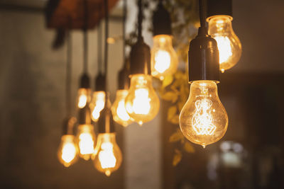 Chandelier with edison lamps in a dark room