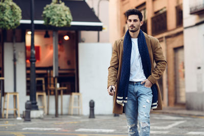 Young man walking on street