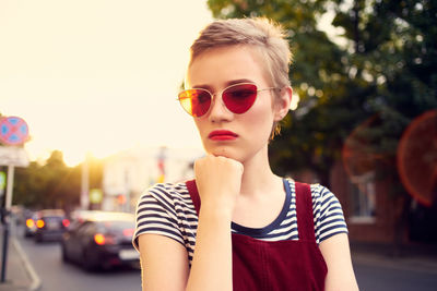 Portrait of young woman wearing sunglasses