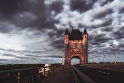 View of bridge and buildings against sky