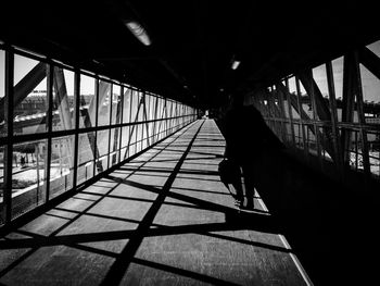 Woman walking on bridge