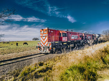 Train on railroad track against sky