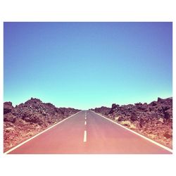 Empty road along landscape