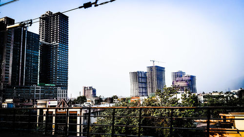 Low angle view of skyscrapers against clear sky