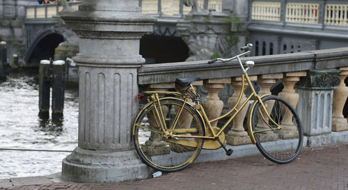 Bicycle against building in city